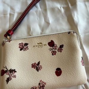Coach corner zip wallet.